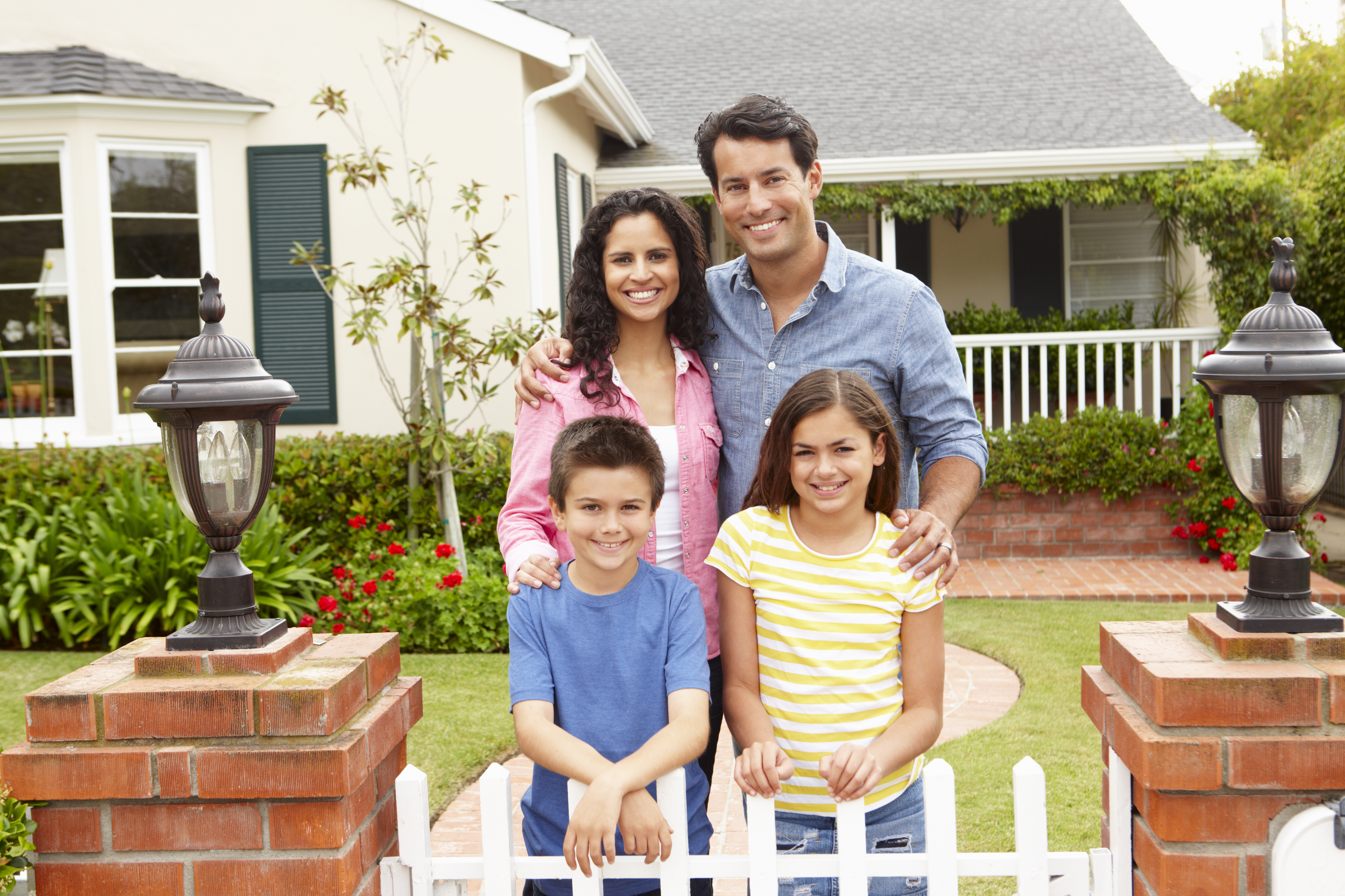 Family in front of house